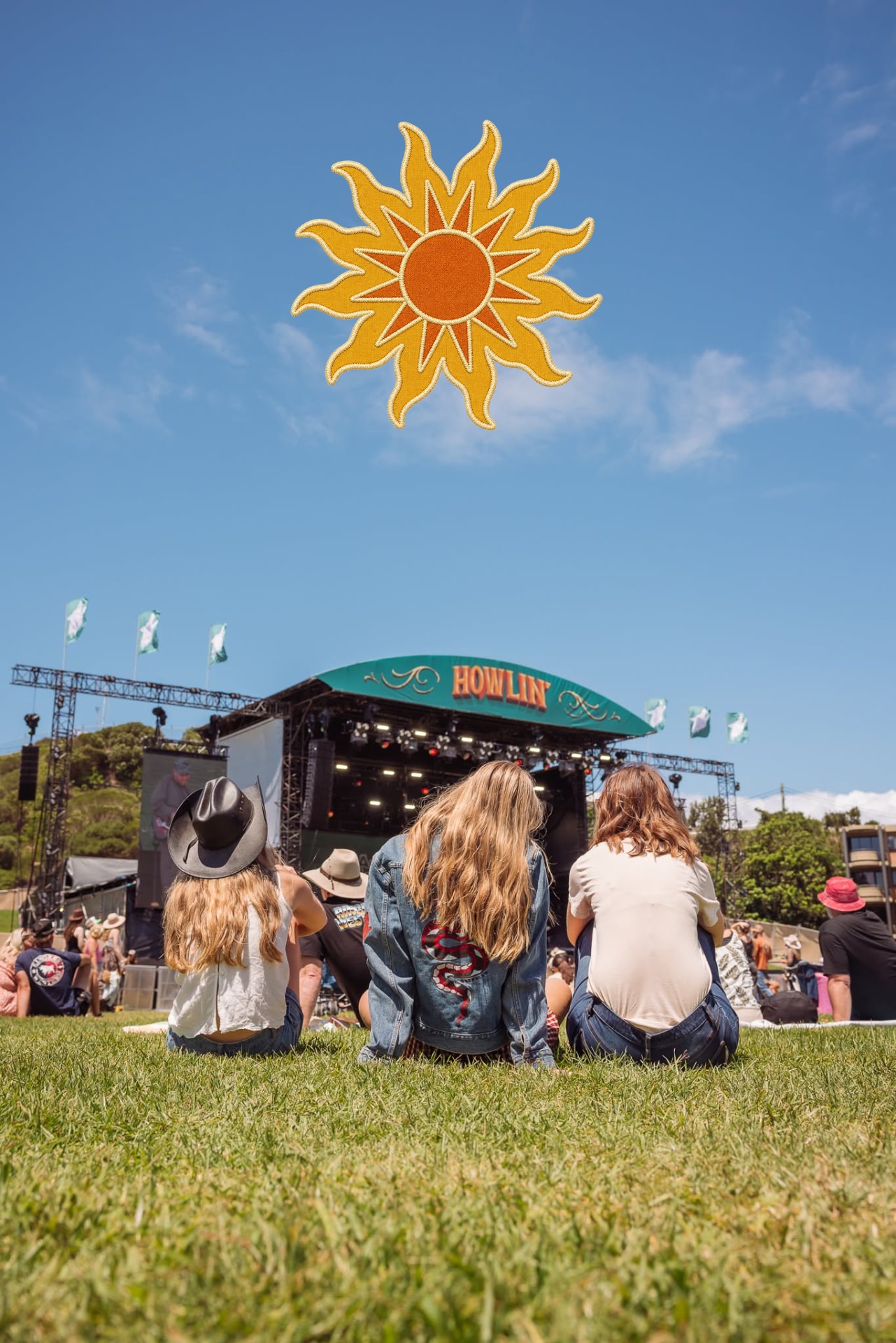 Festivalgoers in cowboy hats enjoying the Howlin' stage during the daytime session